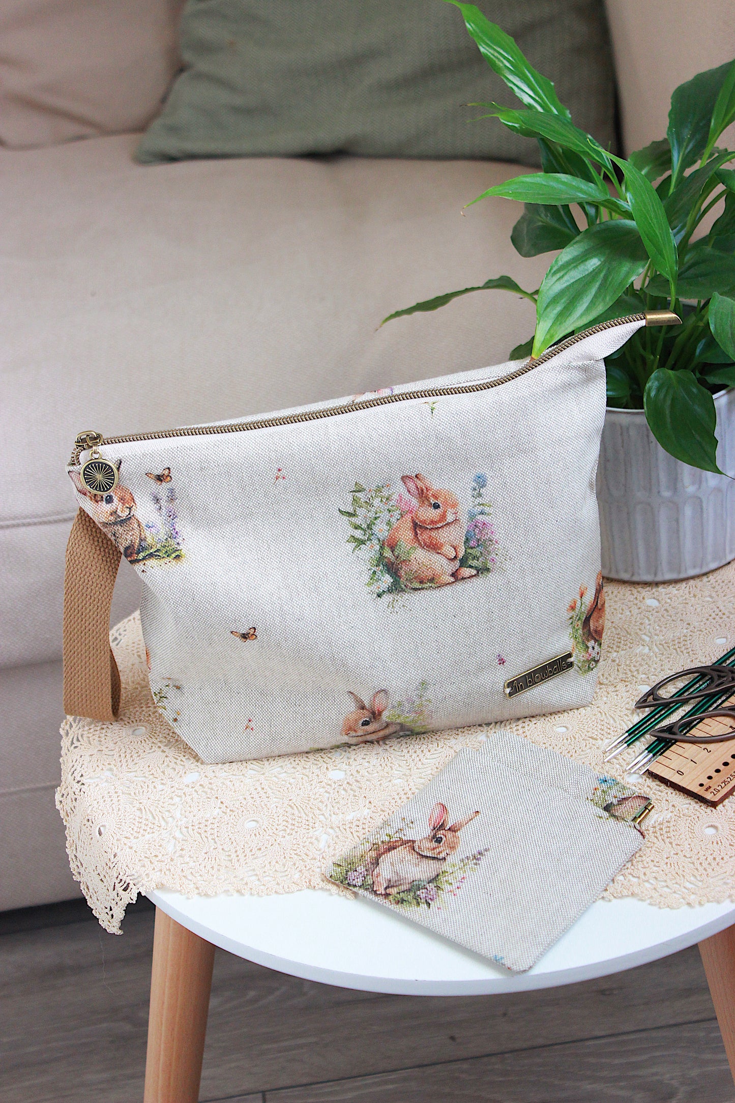 Knitting project bag with DPN holder Rabbits Canvas Fabric, featuring a rabbit and flower print, perfect for knitting on the go.