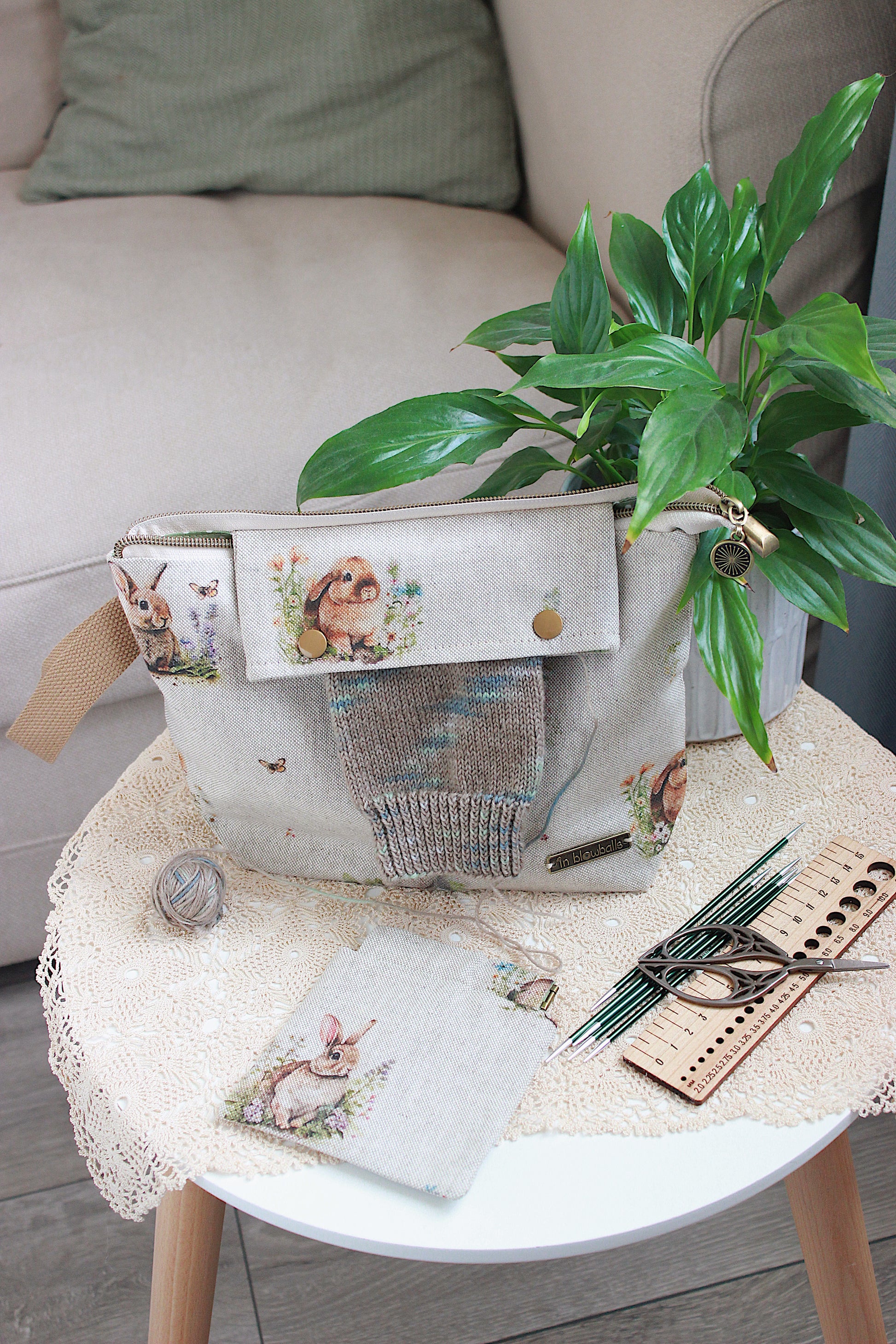 Knitting project bag with DPN holder Rabbits Canvas Fabric, featuring a rabbit and flower print, perfect for knitting on the go.
