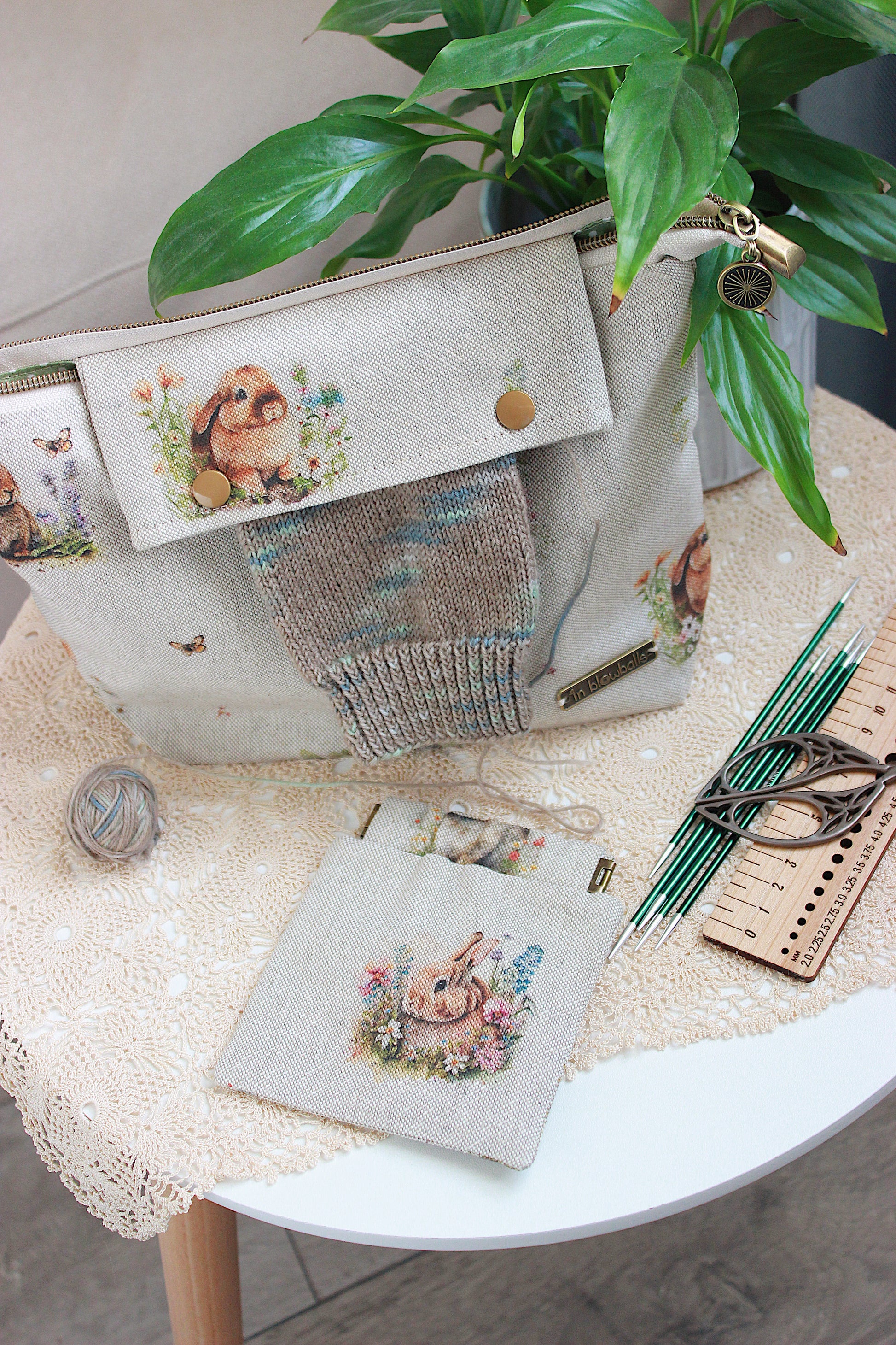Knitting project bag with DPN holder Rabbits Canvas Fabric, featuring a rabbit and flower print, perfect for knitting on the go.