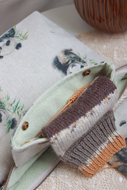 Knitting Project Bag with Built-in DPN Holder & Matching Squeeze Purse Baby Panda Print Printed Digital Canvas Fabric on a table. Knitting Project Bag with Built-in DPN Holder & Matching Squeeze Purse Baby Panda Print Printed Digital Canvas Fabric on a table.