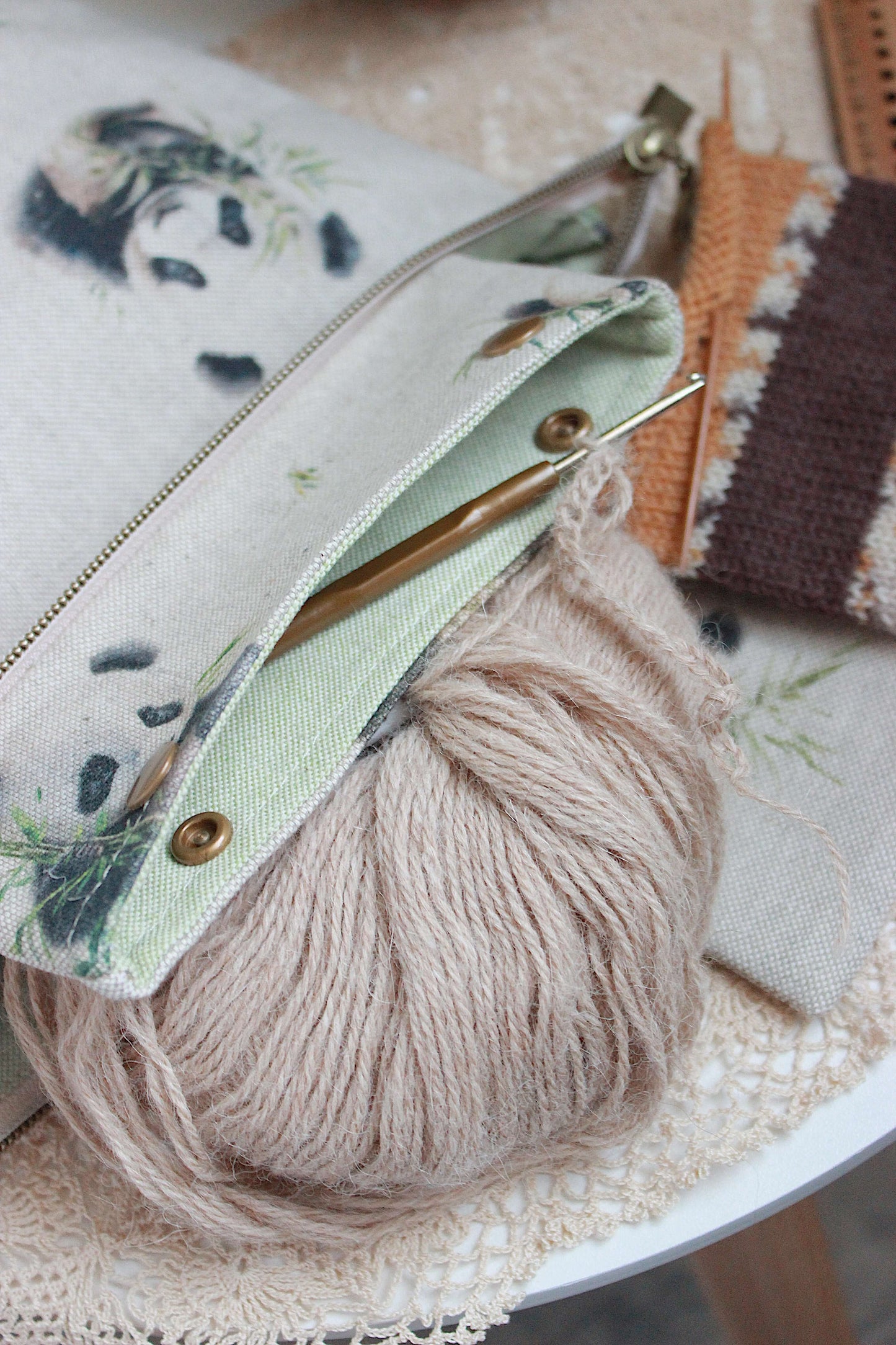 Knitting Project Bag with Built-in DPN Holder & Matching Squeeze Purse Baby Panda Print Printed Digital Canvas Fabric on a table. Knitting Project Bag with Built-in DPN Holder & Matching Squeeze Purse Baby Panda Print Printed Digital Canvas Fabric on a table.