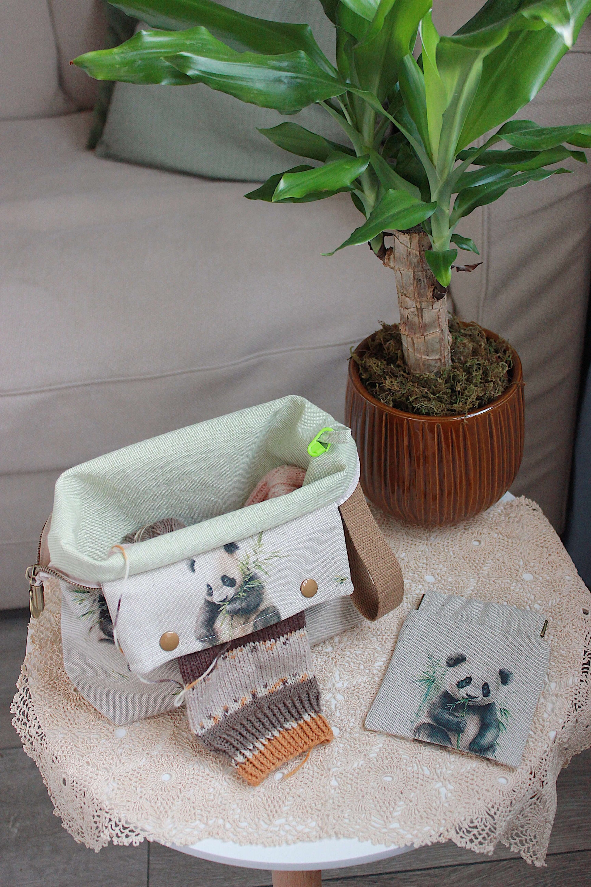 Knitting Project Bag with Built-in DPN Holder & Matching Squeeze Purse Baby Panda Print Printed Digital Canvas Fabric on a table.