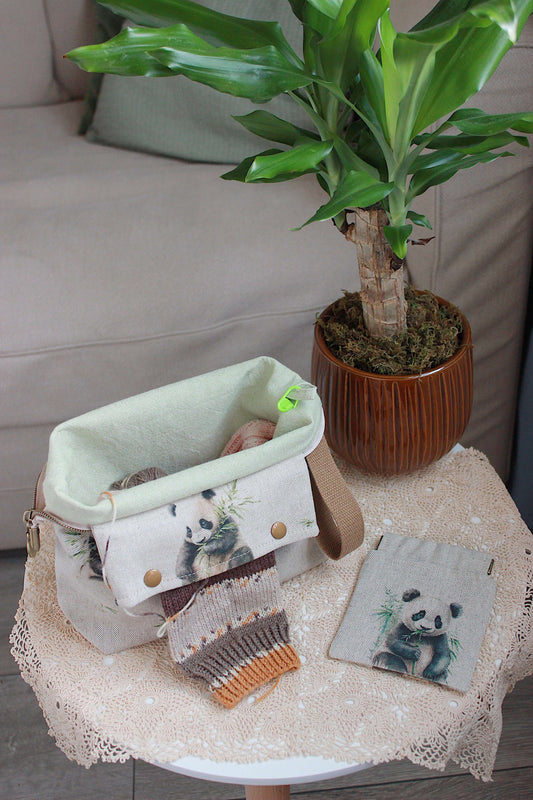 Knitting Project Bag with Built-in DPN Holder & Matching Squeeze Purse Baby Panda Print Printed Digital Canvas Fabric on a table.